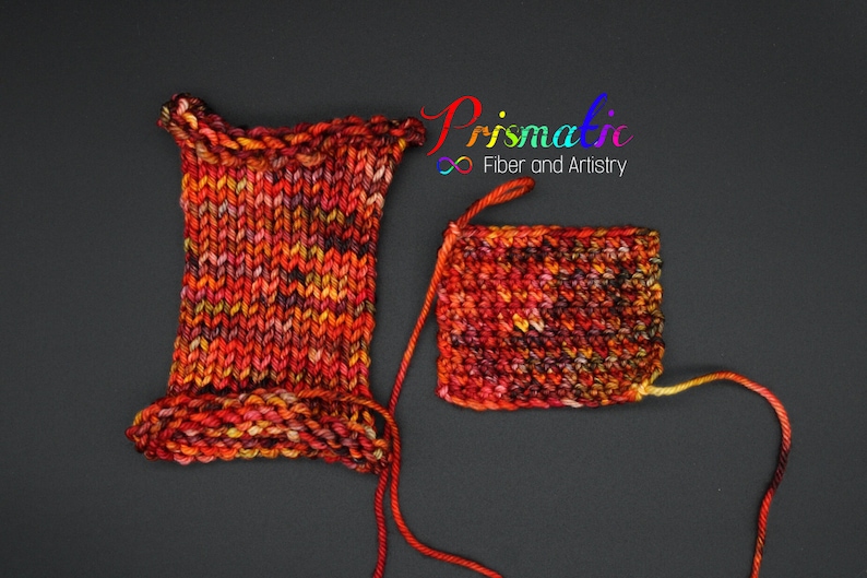May include: Two swatches of yarn in a multi-colored blend of red, orange, yellow, and black. The yarn is knit into a square and a rectangle. The text "Prismatic Fiber and Artistry" is visible in the top right corner of the image.