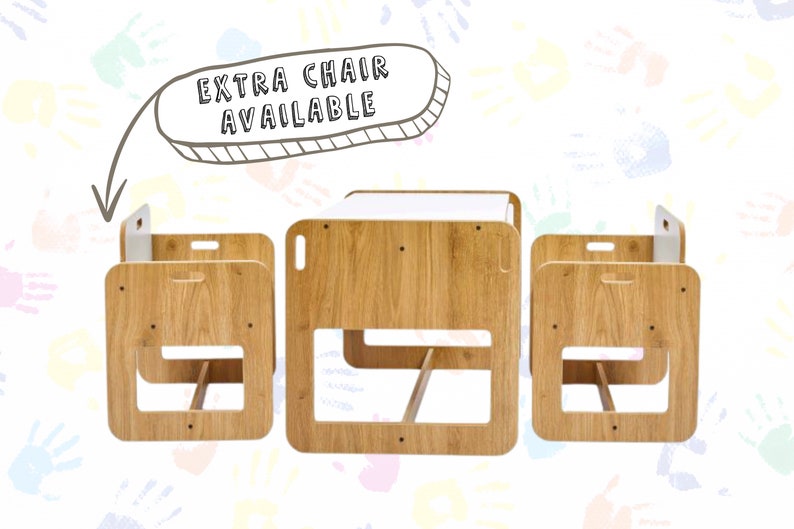 May include: A wooden children's table and two chairs set. The table has a white top and the chairs have a storage compartment. The set is made of natural wood and has a simple, modern design.  "Extra chair available" is written on a speech bubble above the set.