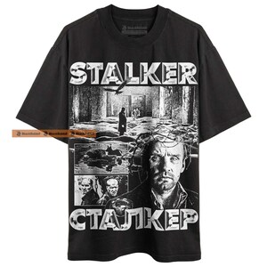 Black graphic t-shirt.