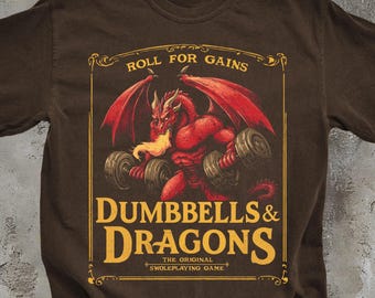May include: Brown t-shirt with a graphic featuring a red dragon lifting dumbbells. The text reads "Roll for Gains" above and "Dumbbells & Dragons" below, with "The Original Swoleplaying Game" at the bottom.