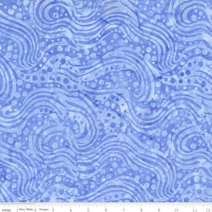 May include: A close-up of a blue fabric with a wavy pattern and dotted accents. The fabric has a watercolor effect, with lighter and darker shades of blue creating depth and texture. The design is reminiscent of flowing water.