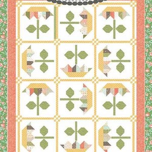 May include: A colorful quilt with a floral design. The quilt features a grid pattern with flower and basket motifs in shades of yellow, green, and peach. The text "Coriander Quilts" and "#221 Sweetest" are visible.