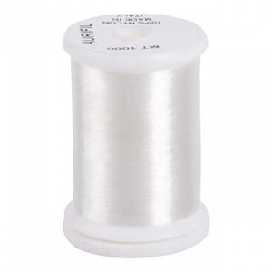 May include: A white spool of Aurifil thread, made of 100% nylon. The spool has a white base and top, with the thread wound around the center. The text "AURIFIL" is printed on the top of the spool.