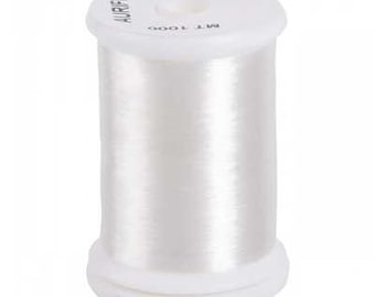 May include: A white spool of Aurifil thread, made of 100% nylon. The spool has a white base and top, with the thread wound around the center. The text "AURIFIL" is printed on the top of the spool.