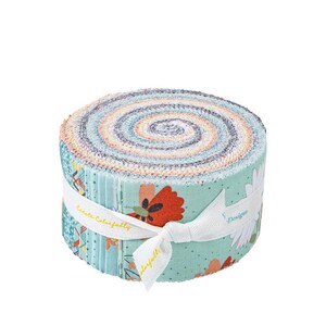 May include: A rolled bundle of colorful fabric strips, featuring a mix of floral and geometric patterns. The fabric is wrapped with a white ribbon that has text and a bow. The color palette includes shades of blue, orange, and green.