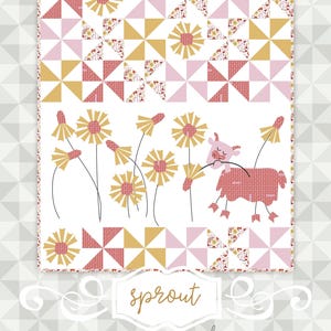 May include: A quilt with a patchwork design in pink, gold, and white. The quilt features a floral and geometric pattern, with a cartoon sheep and flowers. The word "sprout" is written in cursive.