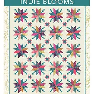 May include: A colorful quilt with a repeating star pattern in shades of pink, teal, and gold. The quilt measures 60" x 74". The text "INDIE BLOOMS" is displayed at the top, with the designer's name, Crystal Manning, above it.