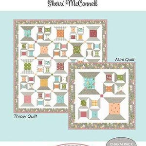 May include: A light blue image featuring two quilts with a spool design. The larger quilt is labeled "Throw Quilt" and the smaller one is labeled "Mini Quilt". The text "a Quilting Life Designs by Sherri McConnell" is at the top, and "Happy Spools" is at the bottom.