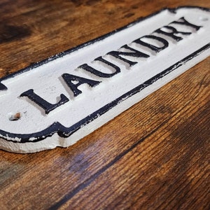 Vintage Cast Iron Laundry Plaque White