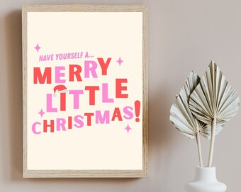 May include: A framed print with a white background and pink and red text that reads "Have yourself a... Merry Little Christmas!"