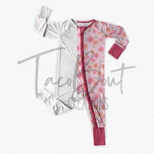 May include: A white and pink long-sleeved zippered sleeper with a floral print on the right side. The sleeper has a red zipper and red cuffs.