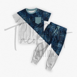 May include: A two-piece pajama set for children featuring a white and blue galaxy print. The top has a blue pocket and the pants have a drawstring.