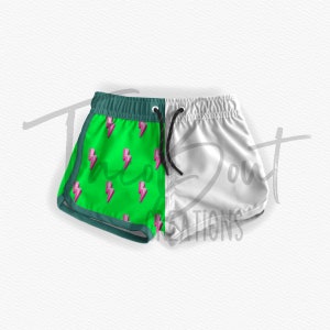 May include: Green and white swim shorts with a pink lightning bolt pattern on the green side. The shorts have a drawstring waist.