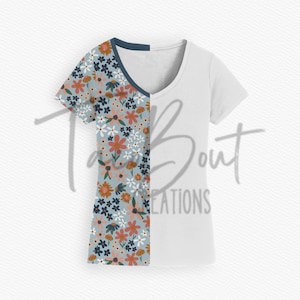 May include: A white t-shirt with a blue and floral pattern on the left side. The floral pattern features pink, orange, yellow, and blue flowers on a light blue background.