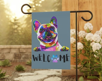 May include: A colourful, abstract French Bulldog peeks over a blue welcome garden flag with a paw print. The flag reads "Welcome".
