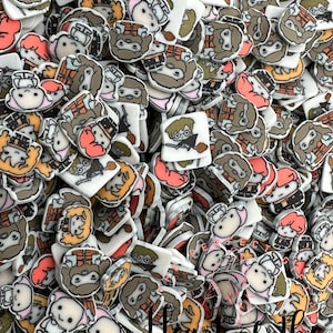 May include: A large pile of colorful resin flatback charms featuring cartoon characters from the Harry Potter series. The charms are in various shapes and sizes, including round, square, and rectangular. The characters include Harry Potter, Ron Weasley, Hermione Granger, and other characters from the series. The charms are perfect for adding a touch of magic to your crafts.