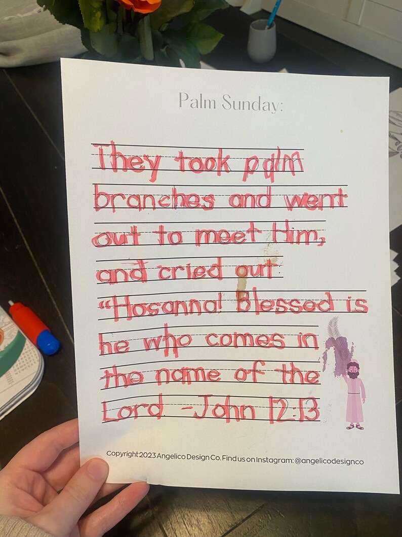 May include: A handwritten note on lined paper with the text "Palm Sunday: They took palm branches and went out to meet Him, and cried out "Hosanna! Blessed is he who comes in the name of the Lord - John 12:13". A small illustration of a person holding a palm branch is in the bottom right corner.