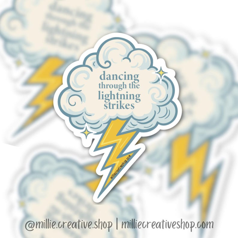 May include: A sticker featuring a cloud with the text "dancing through the lightning strikes" and a yellow lightning bolt. The cloud is light blue with a white outline. The sticker also includes the shop's social media handle and website.