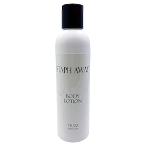 May include: White body lotion bottle with a black cap. The label reads "STAPH AWAY BODY LOTION" and "7.0 OZ MADE IN USA". The bottle is cylindrical and has a clean, minimalist design.