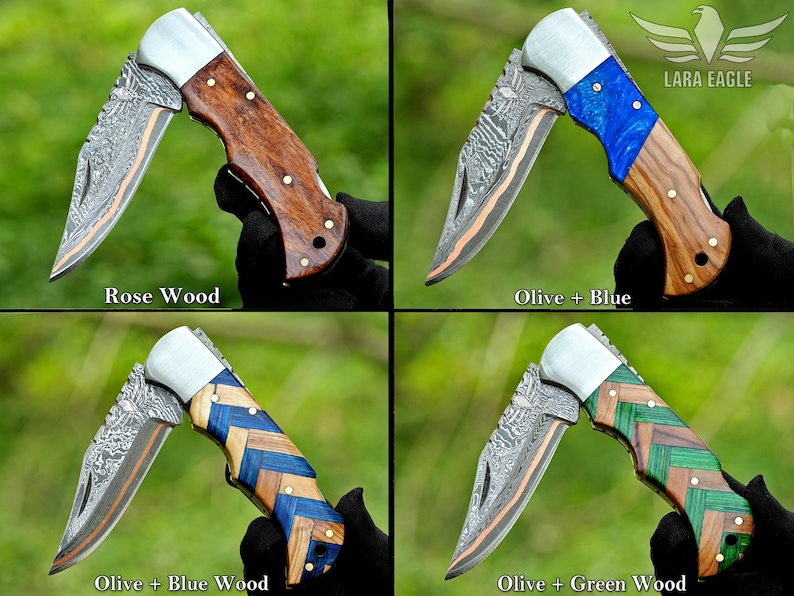 May include: Four folding knives with unique handle designs. One features rosewood, another olive and blue, a third olive and blue wood, and the last olive and green wood. Each knife has a patterned blade and silver accents. The Lara Eagle logo is visible.