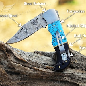 May include: A folding pocket knife with a Damascus steel blade, turquoise handle, and a steel bolster. The handle features a pocket clip and a back lock.