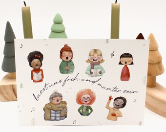 Tarjeta navideña colorida “Coro infantil” con ilustración en acuarela