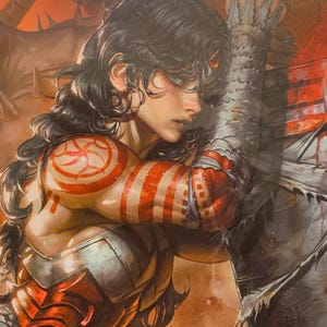 May include: Comic book illustration of a person with long dark hair and blue eyes, adorned with red and white markings on the arm and shoulder. The person is wearing red and silver armor, with a large, spiky, gray object in the background.