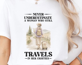 Never Underestimate A Woman Who Still Travels In Her Eighties Shirt, Travel Grandma Tee, Funny Senior Traveler Gift, Adventure Lover T‑Shirt