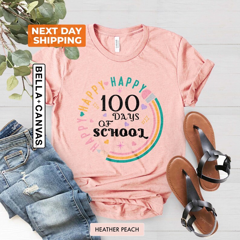 May include: A pink t-shirt with a rainbow design and the text "Happy 100 Days of School".