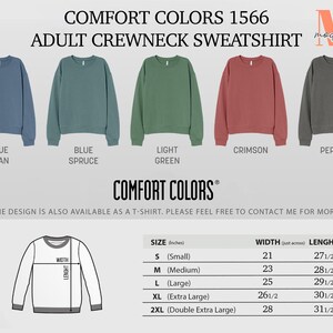 May include: Five different color crewneck sweatshirts in blue jean, blue spruce, light green, crimson, and pepper. The sweatshirts are shown on a white background with the text "COMFORT COLORS 1566 ADULT CREWNECK SWEATSHIRT" above them. A size chart is shown below the sweatshirts with the text "SIZE (inches) WIDTH (laid across) LENGHT" at the top. The size chart lists the sizes S, M, L, XL, and 2XL with the corresponding width and length measurements in inches.