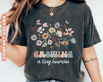 Comfort Colors® Growing A Tiny Human Shirt, Wildflowers Pregnancy Shirt, Pregnancy Announcement Shirt For Mom-To-Be Gift, Maternity T-Shirt