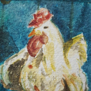May include: A watercolour painting of a rooster, featuring a red comb and wattle, and yellow and white feathers. The background is a blend of blue and teal hues, creating a textured effect. The artwork is a close-up, showcasing the rooster's features.