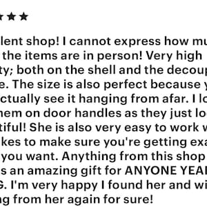May include: Five-star review of an Etsy shop, praising the quality, size, and ease of working with the seller. The review mentions using the items as door handles and states that they make great gifts.