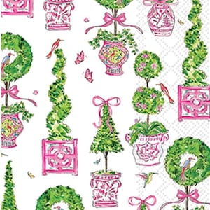 May include: A white background with a repeating pattern of green topiary trees, wreaths, and decorative pots in pink. The design includes pink bows, butterflies, and birds. A pink Greek key border frames the bottom.
