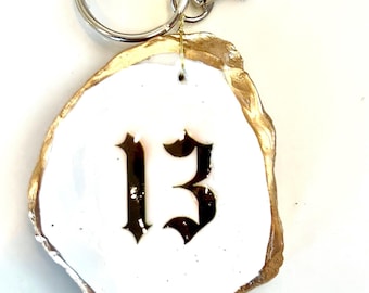 Thirteen keychain Swiftie gift idea. Swiftie gift decoupaged oyster key chain. Swiftie party favor idea. Taylor Eras favor keychain favor
