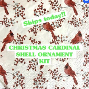 red cardinals with red winter berries napkin with the words Christmas Cardinal shell ornament craft kit ships today