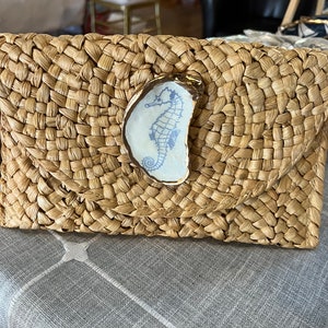 Straw clutch purse. Oyster shell clutch. Oyster shell purse. Resort wear. Cruise wear.