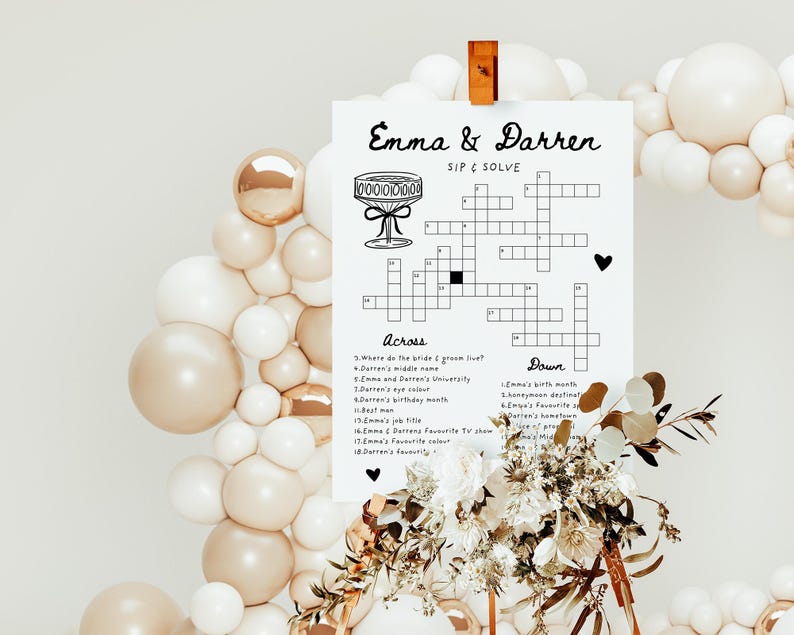 Pu&ograve; includere: Un gioco di cruciverba stampabile con il titolo "Emma & Darren Sip & Solve". Il cruciverba &egrave; circondato da uno sfondo bianco con un arco di palloncini decorativo sullo sfondo.
