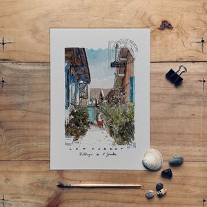 May include: Watercolor print of a village scene, featuring buildings with blue and brown accents, lush greenery, and a narrow pathway. The print includes text that reads "CAP FERRET Village de l'Herbe."
