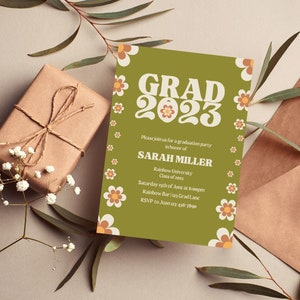 May include: A green and white graduation party invitation with a retro font that says "GRAD 2023". The invitation is decorated with orange and white flowers. The text reads "Please join us for a graduation party in honor of Sarah Miller, Rainbow University, Class of 2023, Saturday 19th of June at 6:00pm, Rainbow Bar, 123 Grad Lane, RSVP to Joan 456-7890."