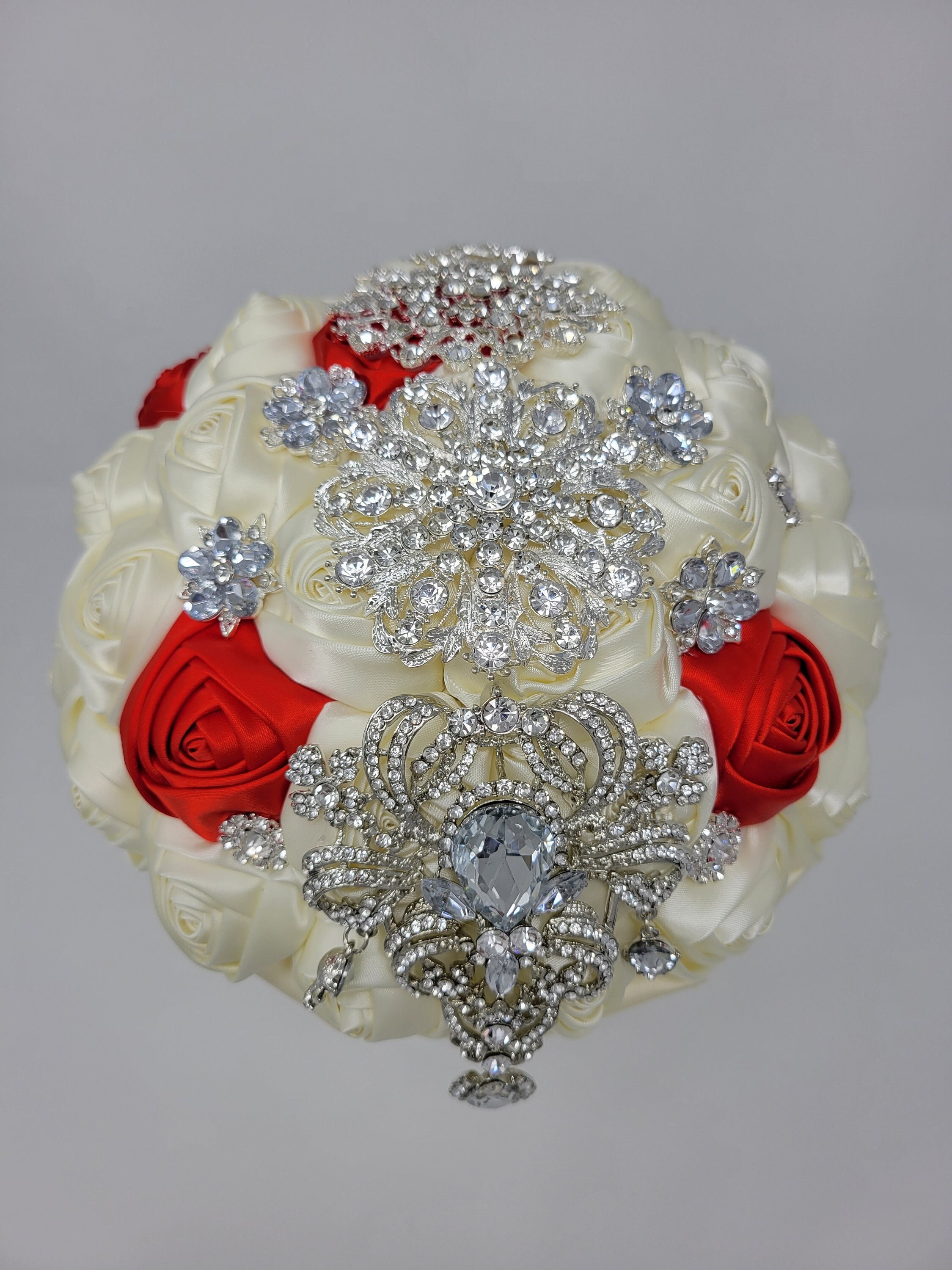 Red roses with diamond studs poked through! Super elegant  Red bouquet  wedding, Rose bridal bouquet, Red rose wedding
