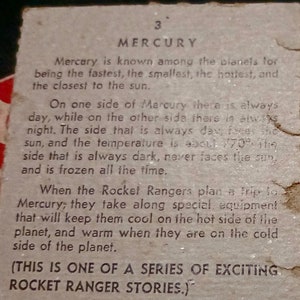 May include: A vintage trading card with a black and white illustration of the planet Mercury. The card features text about the planet Mercury, including its temperature and the fact that it is the fastest, smallest, and hottest planet in our solar system. The text also mentions that the Rocket Rangers plan a trip to Mercury and will take along special equipment to keep them cool on the hot side of the planet and warm on the cold side. The card also includes the text "(THIS IS ONE OF A SERIES OF EXCITING ROCKET RANGER STORIES.)"