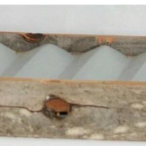 May include: A rectangular wooden tray with a light gray interior featuring a series of wave-shaped dividers. The tray has a rustic, weathered appearance with visible wood grain and knots. The frame is made of a darker wood.