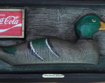 vintage coca cola red head and Mallard duck sign