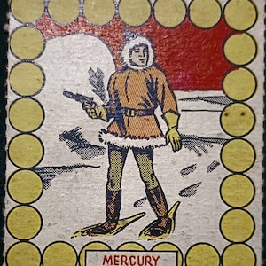 May include: A vintage illustration of a person wearing a fur-trimmed coat and snowshoes, holding a gun. The illustration is surrounded by a border of yellow circles. The text "MERCURY" is printed below the illustration.