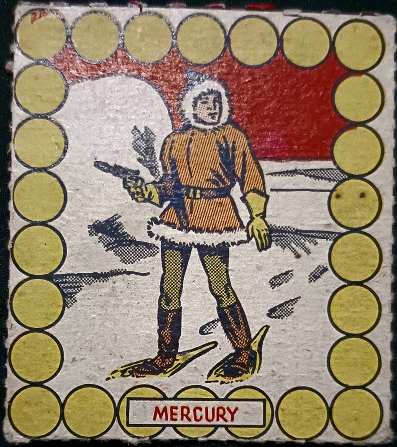 May include: A vintage illustration of a person wearing a fur-trimmed coat and snowshoes, holding a gun. The illustration is surrounded by a border of yellow circles. The text "MERCURY" is printed below the illustration.