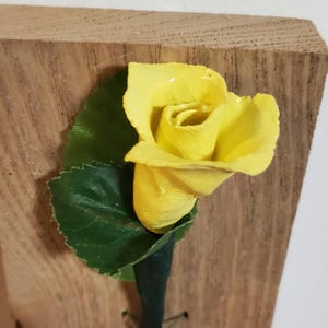 Mother's Day or any day Gift for her clay Rose on Wooden background. Yellow
