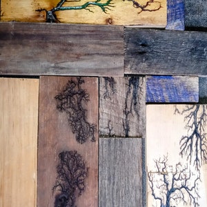 May include: A wooden wall art piece made of reclaimed wood planks with a variety of wood grain patterns and colors. The wood has been treated with a dark stain and features a unique lightning bolt design.