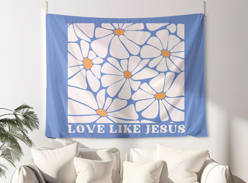 May include: A blue tapestry with a white daisy pattern and the text "LOVE LIKE JESUS" in white letters.