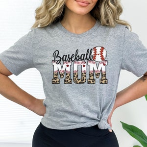 May include: Gray t-shirt with a baseball graphic and the text "Baseball Mom" in black with a leopard print design.
